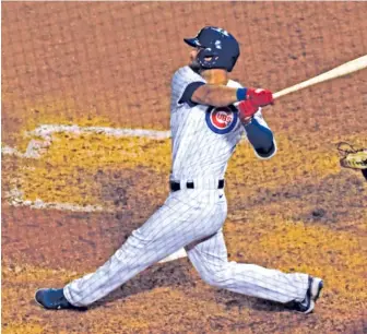  ?? MATT MARTON/AP ?? David Bote blasts a three-run homer in the sixth inning Monday night against the Cardinals.