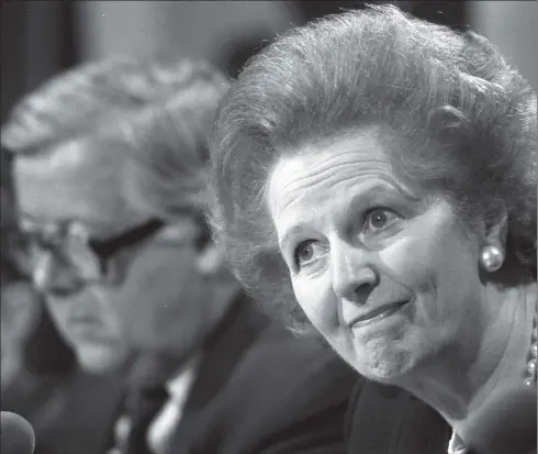  ??  ?? Margaret Thatcher fielding questions with Foreign Secretary Sir Geoffrey Howe at a press conference in London in May 1989, an annus horribilis for the then-PM.