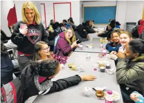  ?? THE ASSOCIATED PRESS ?? Students have breakfast Wednesday at Stonewall Jackson Middle School in Charleston, W.Va. West Virginia’s teachers and students are reunited in their classrooms after a walkout that closed schools statewide.