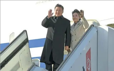  ?? LEHTIKUVA/ANTTI AIMO-KOIVISTO/VIA REUTERS ?? President Xi Jinping and his wife, Peng Liyuan, arrive at Helsinki Airport in Vantaa, Finland, on Tuesday for a state visit. He will meet with Finnish President Sauli Niinisto.