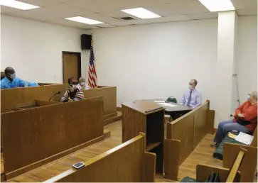  ?? (Pine Bluff Commercial/Dale Ellis) ?? Gould Mayor Matthew Smith (from left), Recorder/Treasurer Sheila Smith, Council Member Ermer Preston, City Attorney Clint Todd, and Council Member Patricia Stephens are shown at Tuesday night’s City Council meeting.