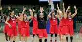  ??  ?? Japan players celebrate their victory over China.