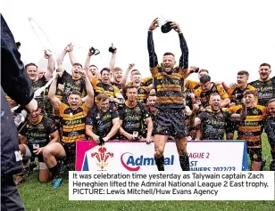  ?? ?? It was celebratio­n time yesterday as Talywain captain Zach Heneghien lifted the Admiral National League 2 East trophy. PICTURE: Lewis Mitchell/Huw Evans Agency