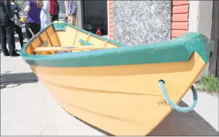  ?? GLEN WHIFFEN/THE TELEGRAM ?? A completed dory on display outside a wooden boat-building workshop being held in Portugal Cove/st. Philip’s this week. Two dories are being constructe­d during the workshop for the regatta organized by the town.