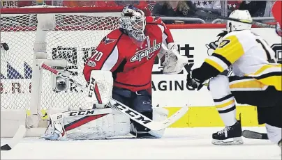  ?? AP PHOTO ?? Pittsburgh Penguins right wing Bryan Rust (17) scores a goal past Washington Capitals goalie Braden Holtby (70) during the second period of Game 7 in an NHL hockey Stanley Cup Eastern Conference semifinal, Wednesday, in Washington. (AP Photo/Alex...