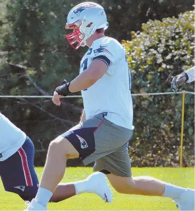  ?? STAFF PHOTO BY CHRIS CHRISTO ?? TOUGH CHALLENGE TO TACKLE: Nate Solder loosens up before practice yesterday as the Patriots prepare to host the Carolina Panthers tomorrow at Gillette Stadium.