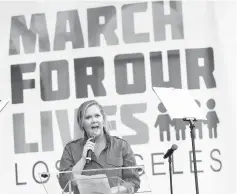  ??  ?? Actor Amy Schumer speaks during ‘March for Our Lives’ in downtown Los Angeles, California, on Saturday. (Below) Singer Miley Cyrus sings at the event. (Bottom left) Singer Jennifer Hudson is hugged by Parkland, Florida, shooting survivor Emma Gonzalez...