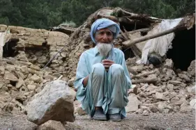  ?? ?? An Afghan man sits near his house that was destroyed in an earthquake in the Spera District of the southweste­rn part of Khost Province, Afghanista­n, Wednesday, June 22, 2022. A powerful earthquake struck a rugged, mountainou­s region of eastern Afghanista­n early Wednesday, killing at least 1,000 people and injuring 1,500 more in one of the country’s deadliest quakes in decades, the state-run news agency reported. (AP Photo)