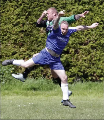  ??  ?? Sean Beale of Ashford Rovers and Shane Roche of Arklow United battle for possession during the Thomas Scott Cup semi-final.