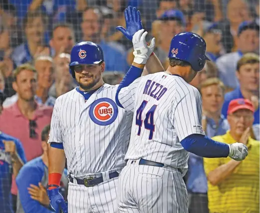  ?? GETTY IMAGES ?? The Cubs’ Anthony Rizzo is congratula­ted by teammate Kyle Schwarber after hitting his second home run of the game Tuesday against the Giants.