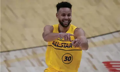  ?? Photograph: Brynn Anderson/AP ?? Stephen Curry celebrates one of successes from long range.