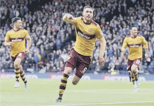  ??  ?? 0 Louis Moult celebrates one of the high points of his Motherwell career, scoring against Rangers in the Betfred Cup semi-final.