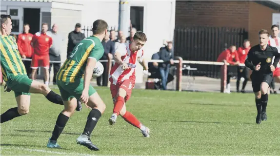  ??  ?? Ryhope CW get a shot away during their game against North Shields at Ryhope Welfare Park on Saturday.