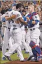  ?? Harry How Getty Images ?? YASIEL PUIG is restrained after an altercatio­n with the Giants’ Nick Hundley.