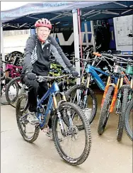  ?? Lynn Atkins/Special to The Weekly Vista ?? Bella Vista resident Grant Spoon test rides a Pivot bike at the Demo Day at Bison Bikes on Sunday.