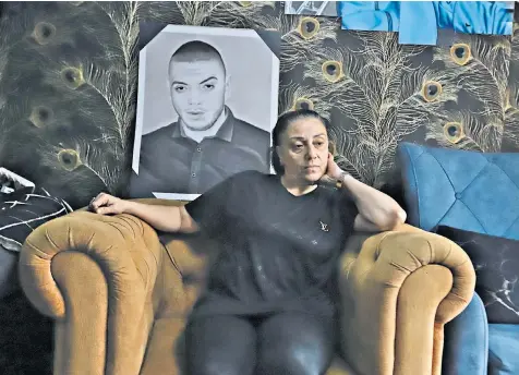  ?? ?? Ayesha Abu al-Rub at home in Haifa. Her son Fadi was shot dead while at work washing cars