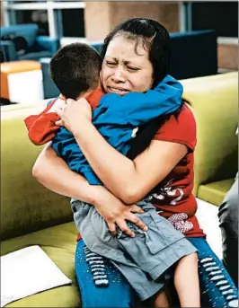  ?? JOE RAEDLE/GETTY ?? A woman originally from Guatemala, identified only as Maria, is reunited with her son Franco, 4, at the El Paso Internatio­nal Airport on July 26.