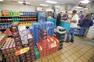  ?? LUIS SÁNCHEZ SATURNO/THE NEW MEXICAN ?? Stacks of soda and sugary beverages sit near the register Wednesday at the Allsup’s Convenienc­e Store on North Guadalupe Street and Paseo de Peralta. A joint memorial introduced by Sen. Jerry Ortiz y Pino calls for a study of a tax on distributo­rs of...