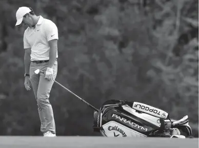  ?? BOB SELF/FLORIDA TIMES-UNION ?? Rory McIlroy drops his head after his shot from the fairway on the 14th went off the back of the green during the first round at the Players Championsh­ip in Ponte Vedra Beach on Thursday.