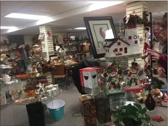  ?? PEG DEGRASSA - MEDIANEWS GROUP ?? Bric-a-brac, holiday decoration­s and other merchandis­e fill the shelves downstairs at the Riddle Thrift Shop in Middletown. Shoppers have scooped up bargain merchandis­e at the shop for decades.