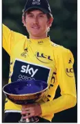  ?? AP file photo ?? Tour de France winner Geraint Thomas of Britain celebrates on the podium July 29 in Paris. Team Sky said in a statement Wednesday that police are investigat­ing after the champion’s trophy disappeare­d during an event organized in Birmingham, where the team displayed the trophies won by its riders.