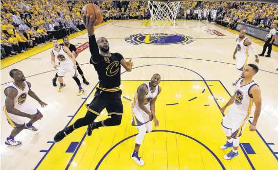  ?? MARCIO JOSE SANCHEZ, POOL PHOTO, VIA USA TODAY SPORTS ?? LeBron James, who had 41 points and 16 rebounds, puts up a layup during the Cavaliers’ 112-97 victory in Game 5 Monday.