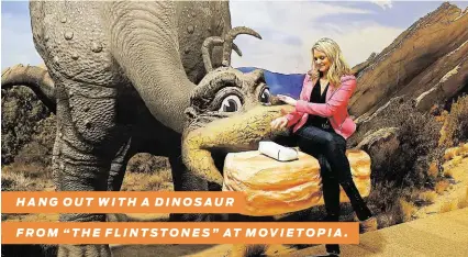  ?? Bob Levey / Getty Images for Movietopia ?? HANG OUT WITH A DINOSAUR
FROM “THE FLINTSTONE­S” AT MOVIETOPIA.