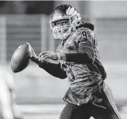  ?? Michael Wyke / Contributo­r ?? New Caney quarterbac­k Zion Childress (9) looks to pass the ball as Porter defensive back Luke Cordle (3) looks on during the first half on Friday.