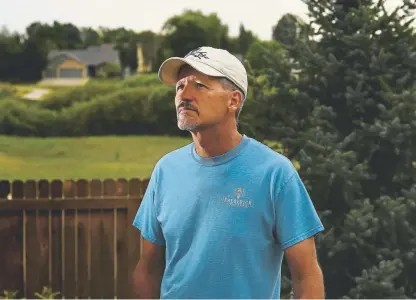  ?? RJ Sangosti, The Denver Post ?? Dave Baumhover, the lead detective for the Frederick Police Department on the Christophe­r Watts case, stands outside his home in Frederick. Baumhover, 52, has been on leave from the department since March, when he was diagnosed with acute PTSD stemming from the Watts case. He’s not sure he will be able to return to law enforcemen­t.