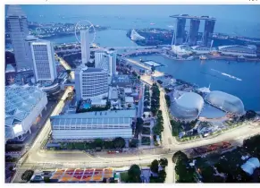  ??  ?? Singapore’s F1 Grand Prix Marina Bay City Circuit is seen lit at dusk on Thursday. (AP)