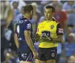  ?? Photo: CRAIG GOLDING ?? QUESTION TIME: Referee Matt Cecchin talks things over with Melbourne Storm captain Cameron Smith last weekend.