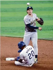  ?? Michael Ainsworth/associated Press ?? Ezequiel Duran, bottom, and the Rangers managed just one hit in Thursday’s loss to the A’s.