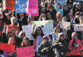  ?? Photos by John Locher / Associated Press ?? Participan­ts cheer during the Women’s March rally at a stadium in Las Vegas. The event capped a weekend of demonstrat­ions held around the globe.