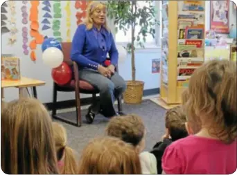  ??  ?? LEFT: Cathrine Williams speaks to a group of Magic Cottage students Friday morning.