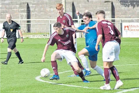  ??  ?? Action from North End’s (maroon) 3-1 Super League win against Lochee United. Pic by Chris Ritchie.