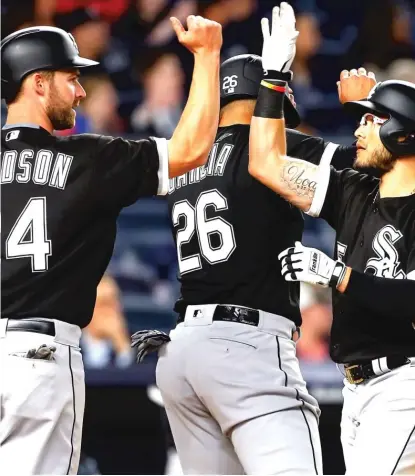  ?? | GETTY IMAGES ?? Matt Davidson, who had singled, greets Yolmer Sanchez after his three- run home run in the seventh inning Monday.