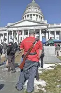  ?? RICK BOWMER/AP FILE ?? Utah law allows this man to carry his weapon without a permit to a Second Amendment gun rally at the Utah State Capitol.