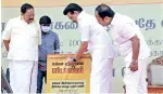  ??  ?? Stalin locking the petition box kept on stage during a campaign meeting at Kandaneri, Anaicut