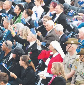  ?? Picture: AAP IMAGE ?? People watch the dawn service at Elephant Rock in Currumbin yesterday.