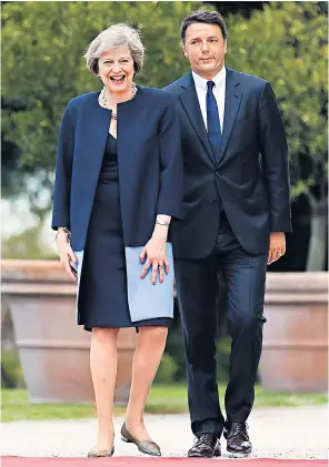  ??  ?? Matteo Renzi, the Italian prime minister, welcomes Theresa May to Rome as she continues a series of visits to EU states