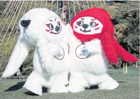  ??  ?? Ren, left, and G are mascots for the 2019 Rugby World Cup.