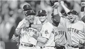  ?? NOAH K. MURRAY/USA TODAY SPORTS ?? The Red Sox celebrate beating the Yankees to advance to the ALCS, but can MLB celebrate its attendance and ratings numbers?