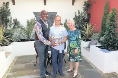  ??  ?? Sean Marsden is presented with his award by Ainsley Harriott and Carol Klein