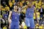  ?? THE ASSOCIATED PRESS FILE PHOTO ?? Paul George Oklahoma City Thunder’s Kevin Durant (35) pats teammate Russell Westbrook (0) on the shoulder as they take a lead over the Golden State Warriors during the second half in Game 1 of the NBA basketball Western Conference finals Monday, May...