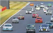  ??  ?? Cars from all eras mark 60 years of the BTCC.