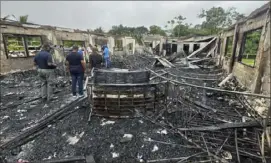  ?? Guyana’s Department of Public Informatio­n via AP ?? The ruins of a dormitory of a secondary school are shown Monday in Guyana. A nighttime fire raced through the dormitory early Monday, killing at least 19 students and injuring several others, authoritie­s said.