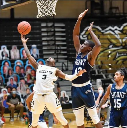  ?? Photos by Jerry Silberman / risportsph­oto.com ?? Bryant sophomore guard Michael Green III, above, struggled in his first game in nearly three weeks, as the Bulldog went just 2-for-12 from the floor in the Bulldogs’ 73-68 NEC Championsh­ip game defeat to Mount St. Mary’s. Peter Kiss, below, had 12 points and 12 rebounds.