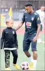  ??  ?? Neymar with his son Davi Lucca during a training session in Sochi, Russia.