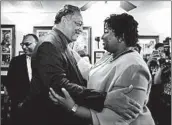  ?? JESSICA MCGOWAN/GETTY ?? The Rev. Jesse Jackson, an activist, greets gubernator­ial candidate Stacey Abrams on Tuesday at a cafe in Atlanta.