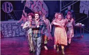  ?? MACKENSIE KING / PHOTO CONTRIBUTO­R ?? Garrett Young (center as Bobby Strong) and the cast of TheatreLab Dayton’s production of “Urinetown.”